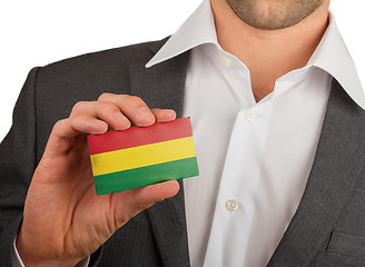 Image showing Businessman is holding a business card, Bolivia