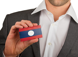 Image showing Businessman is holding a business card, Laos