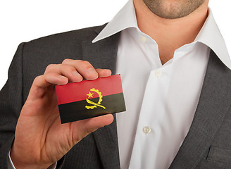 Image showing Businessman is holding a business card, Angola