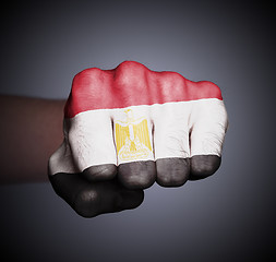 Image showing Front view of punching fist on gray background