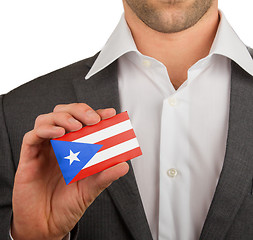 Image showing Businessman is holding a business card, Puerto RIco