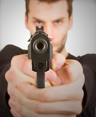 Image showing Man with a gun ready to shoot