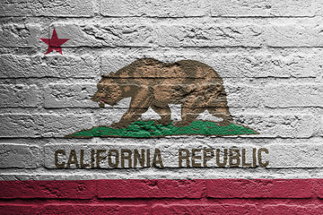 Image showing Brick wall with a painting of a flag, California