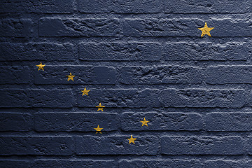 Image showing Brick wall with a painting of a flag, Alaska