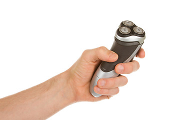 Image showing Hand holding an electric shaver 