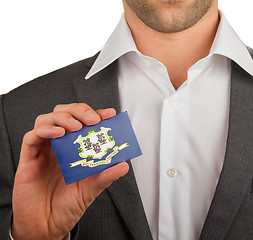 Image showing Businessman is holding a business card, Connecticut