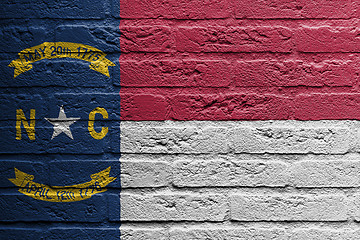 Image showing Brick wall with a painting of a flag, North Carolina