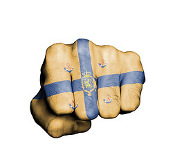 Image showing Front view of punching fist on gray background