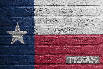 Image showing Brick wall with a painting of a flag, Texas