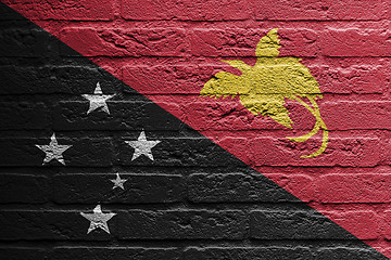 Image showing Brick wall with a painting of a flag, Papua New Guinea