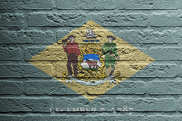 Image showing Brick wall with a painting of a flag, Delaware