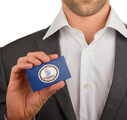 Image showing Businessman is holding a business card, Virginia