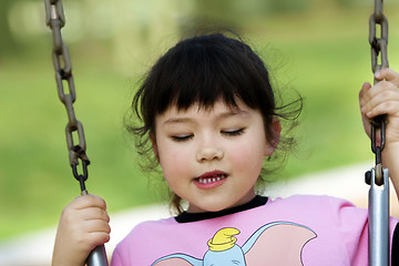 Image showing Baby girl swinging