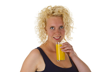 Image showing Young woman with glass orange juice 