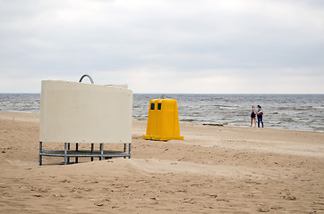 Image showing wear change cabin waste bin sea beach people 