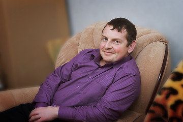 Image showing Portrait of a young man in a chair