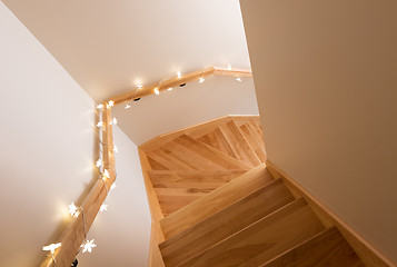 Image showing Lights decorating wooden staircase