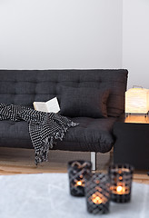 Image showing Gray sofa and cozy lights in the living room