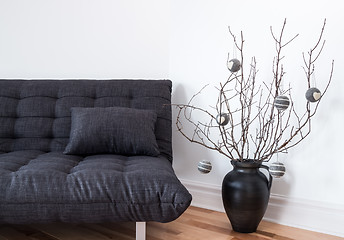 Image showing Gray sofa and simple winter decorations