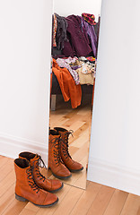 Image showing Clothes and shoes reflecting in the mirror 