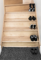 Image showing Shoes on a wooden staircase