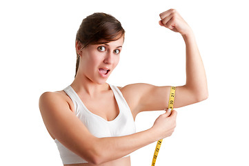 Image showing Shocked Woman measuring her Biceps