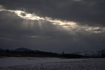 Image showing Sunshine Though Dark Clouds