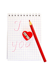 Image showing Sharpener in the shape of heart with an inscription in notepad