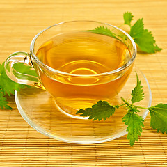 Image showing Herbal tea with nettles on a bamboo mat