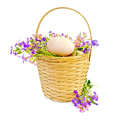 Image showing Eggs with flowers in a wicker basket