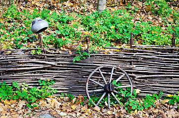 Image showing Cartwheels the fence