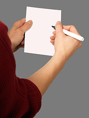 Image showing woman with chit and pen