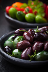 Image showing Mixed olives with raw snack vegetable