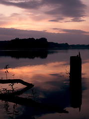 Image showing Romantic sunset on the lake with fog