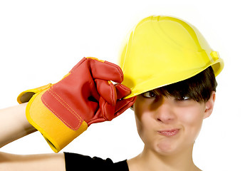 Image showing Girl in yellow hard hat and red gloves with funny face