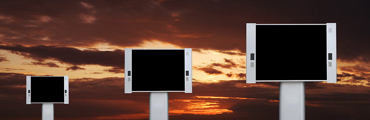 Image showing Blank advertising billboards with sunset sky background