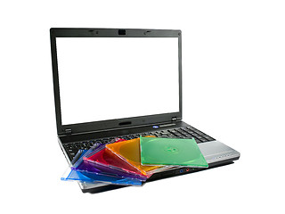 Image showing Colored cd`s on a laptop