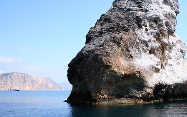 Image showing Rocks and endless sea with clear blue sky