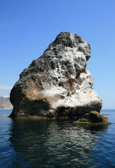 Image showing Rocks and endless sea with clear blue sky
