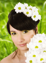 Image showing Girl with spring flowers.Glamor effect.