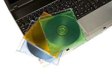 Image showing Colored cd`s on a laptop