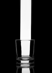 Image showing Empty glass on black. Abstract image
