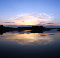 Image showing Romantic sunset on the lake with fog