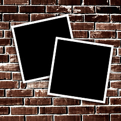 Image showing Empty instant photos on grunge brick wall background