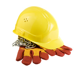 Image showing Yellow hard hat, protective gloves and steel chain isolated