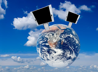 Image showing Blank billboards on the earth with blue sky background