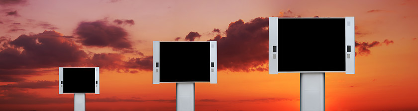 Image showing Blank advertising billboards with sunset sky background