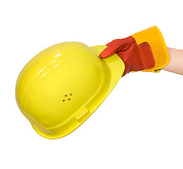 Image showing Hand in glove holding a yellow hard hat isolated