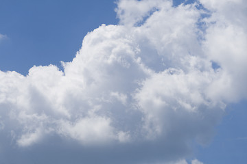 Image showing Puffy clouds on blue sky