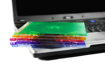 Image showing Colored cd`s on a laptop